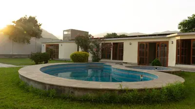 a swimming pool in the yard of a house at Casa Grande de Campo en Huachipa in Lima