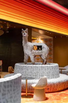a statue of a sheep standing on a table at Nhow Lima in Lima