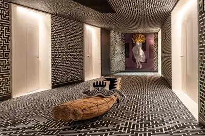 a room with a large bed in the middle of a room at Nhow Lima in Lima