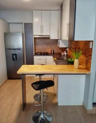a kitchen with a wooden counter top in a kitchen at Bonito y Moderno 1 o 2 dormitorios in Lima