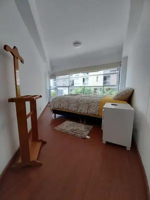 a small bedroom with a bed and a window at Fantastic Location in Miraflores in Perú in Lima
