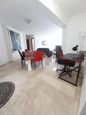 a living room with a table and chairs at Fantastic Location in Miraflores in Perú in Lima