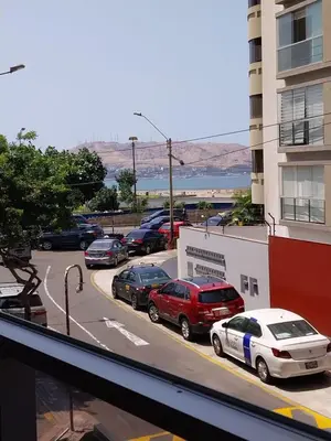 a group of cars parked in a parking lot at Fantastic Location in Miraflores in Perú in Lima