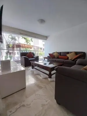 a living room with couches and a coffee table at Fantastic Location in Miraflores in Perú in Lima