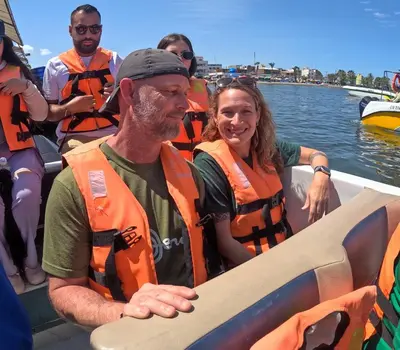 a group of people in life jackets on a boat at Adanny Tours Peru in Lima