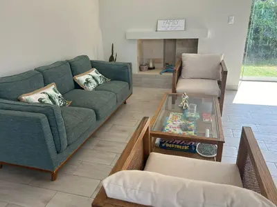 a living room with a couch and a coffee table at Casa de campo en Condominio in San Vicente de Cañete