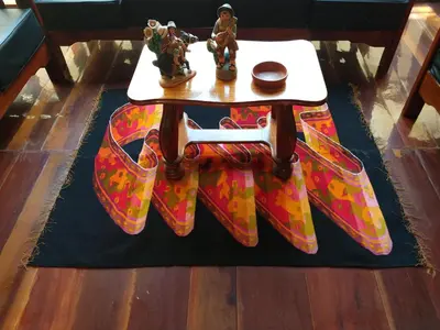a table with some figurines on top of a rug at Hotel Rivera in Ayacucho