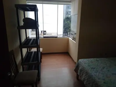 a room with a room with a bed and a window at Departamento Centro Financiero San isidro in Lima