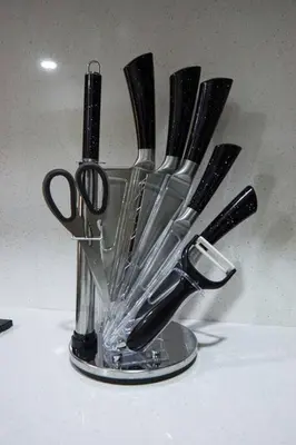 a group of knives in a glass container at Departamento de Estreno Lima Miraflores in Lima
