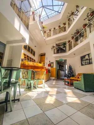 a living room with a skylight in a building at Central Market Hotel San pedro in Cusco