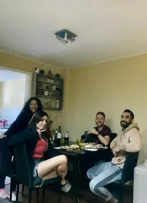 a group of people sitting around a table at Sai in Lima