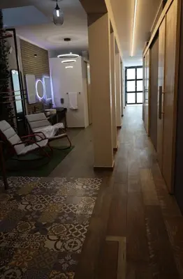 a hallway of an office building with chairs and tables at Casa sabina hostel in Lima