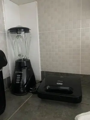 a blender sitting on a counter next to a wall at e-t*| Apartamento frente al mar in Cerro Azul