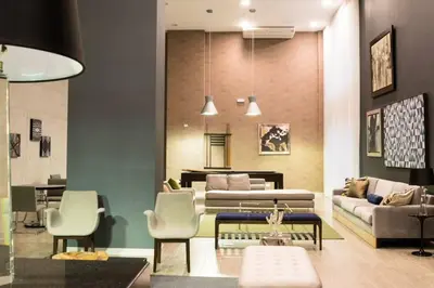 a living room with a couch and a table and chairs at Luxury Apartments Moon Suites Top in Lima