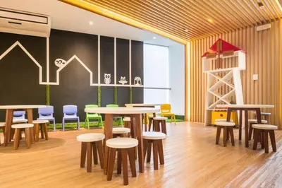 a restaurant with tables and stools in a room at Luxury Apartments Moon Suites Top in Lima