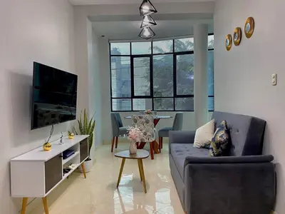 a living room with a couch and a table at Paloma House in Lima