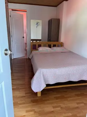 a bedroom with a large bed in a room at Hospedaje Casablanca in Pozuzo