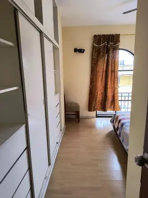 a bedroom with a bed and a window at Departamento frente a palacio gobierno in Lima
