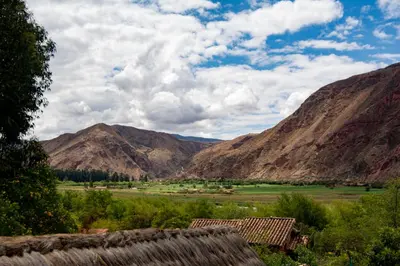 a view of a valley with mountains in the background at La Rosa Wellness Lodge in Urubamba