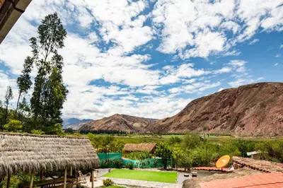 a view from the roof of a village in the mountains at La Rosa Wellness Lodge in Urubamba