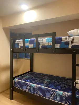 two bunk beds in a room with a train on it at Entire Apartment 20 min from airport - Cozy and Secure in Lima