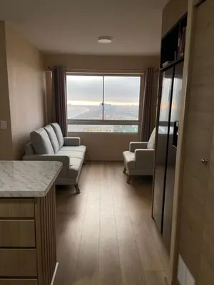 a living room with a couch and chairs and a large window at Entire Apartment 20 min from airport - Cozy and Secure in Lima
