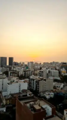 a city skyline with the sunset in the background at Habitación con Baño privado en Departamento Compartido in Lima