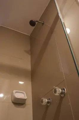 a shower stall with a toilet in a bathroom at Andes House Cusco in Cusco