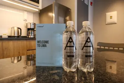 two water bottles on a counter with a welcome to limbo sign at Living 110 Suites by Wynwood House in Lima
