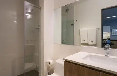 a bathroom with a sink and a toilet and a shower at Living 110 Suites by Wynwood House in Lima