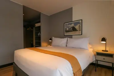 a bedroom with a large white bed in a room at Living 110 Suites by Wynwood House in Lima