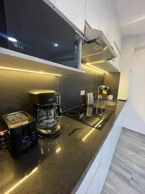 a kitchen with a coffee maker on a counter at Lama Vista Living 201 in Cusco