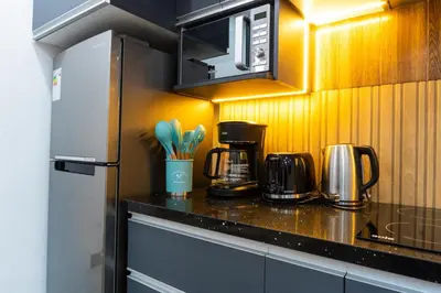 a kitchen with a counter with appliances on it at Lama Vista Living 201 in Cusco