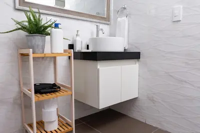a bathroom with a white sink and a counter at Private Residences by Vibrant in Lima