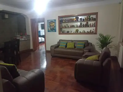 a living room with two couches and a table at Eli Travelers House in Lima