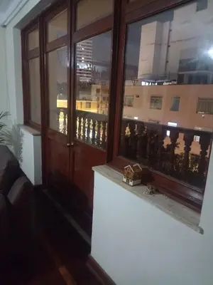 a window with a view of a city at Eli Travelers House in Lima