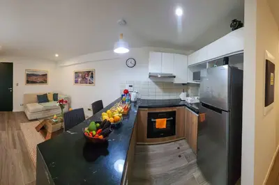 a kitchen with a table with fruit on it at Apartamento completo en Barranco in Lima