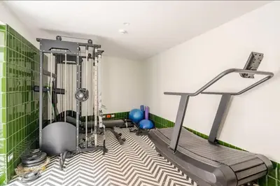 a room with a gym with a treadmill at Apartamento completo en Barranco in Lima