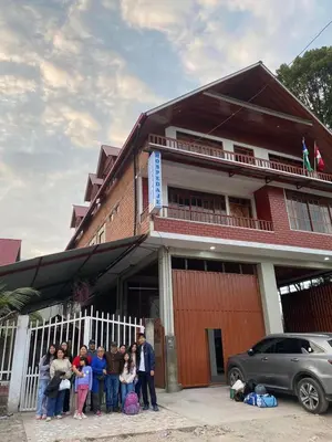 a group of people standing in front of a building at LagunaNegra Oxapampa in Palmira