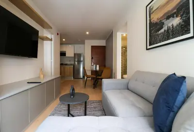 a living room with a couch and a table at Barron by Wynwood House in Lima