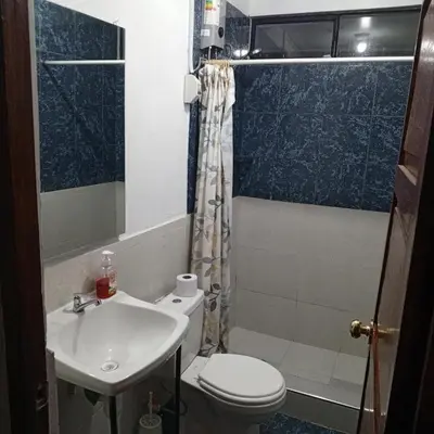 a bathroom with a toilet and a sink at Hospedaje Rochi House - Cusco- En el Corazón del Cusco in Cusco