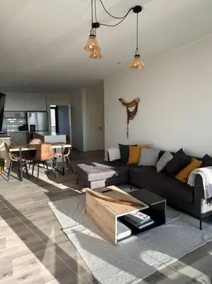 a living room with a couch and a table at Aldea Bayfront Heaven Paracas in Paracas