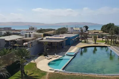 an overhead view of a swimming pool in a resort at Aldea Bayfront Heaven Paracas in Paracas