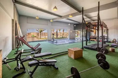 a gym with several exercise equipment in a room at Aldea Bayfront Heaven Paracas in Paracas
