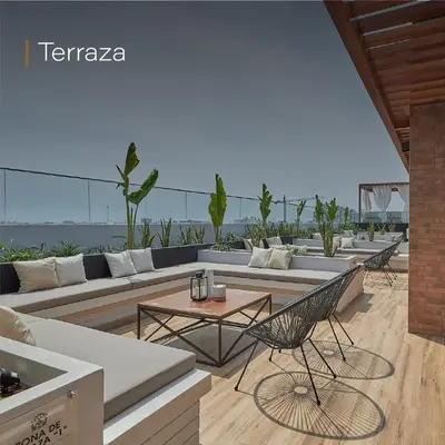 a living room with a couch and a table and chairs at Deluxe Aparment San Isidro in Lima