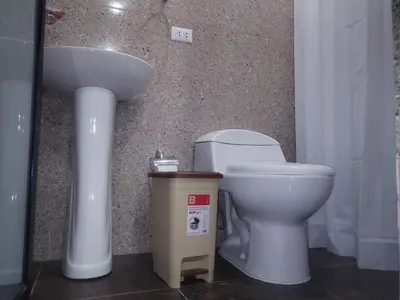 a bathroom with a sink and a toilet at Yompor's haus in Oxapampa