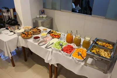 a table with many different types of food on it at Hotel Wiracocha Machupicchu in Machu Picchu