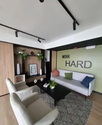 a living room with a couch and two chairs at María Paz Home in Lima