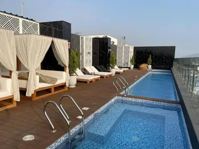 a swimming pool on the roof of a building at Departamento en Barranco - Like at Home in Lima