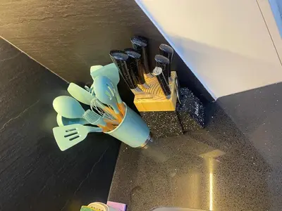 a bunch of utensils in a holder on a counter at Lama Vista Living 202 in Cusco